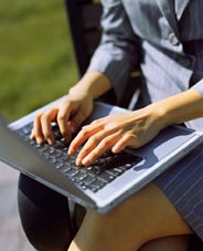 image of hands on laptop keyboard